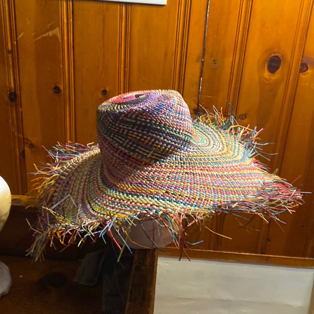 Used straw hat with nice blooming colors